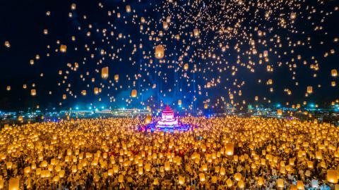 A huge crowd releases beautiful lanterns into the night sky