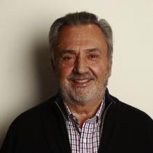 Fermin del Valle, head and shoulders smiling at the camera