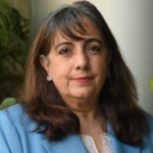 Khursheed Kotwal, a woman smiling at the camera wearing a blue blazer